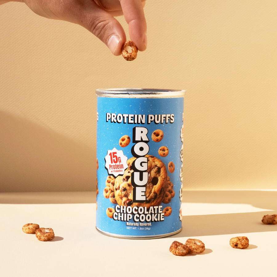 A hand taking a puff from the can